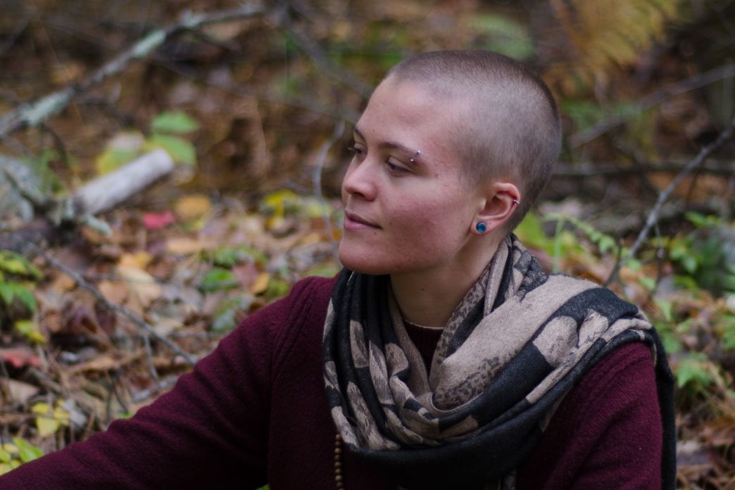 Vanessa Hale sitting in the woods